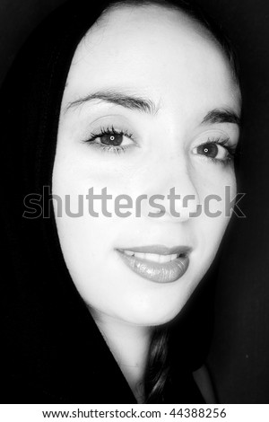 A cloaked woman in black and white.