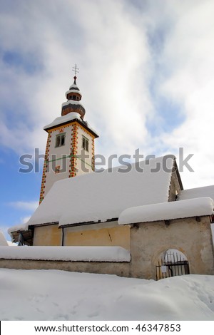 A church covered in Show Bled Slovenia.