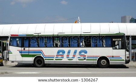 Tour bus in white with blue pattern