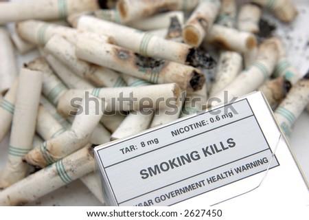 Government warning message: Smoking Kills, in cigarette butts background