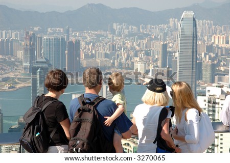 Family sightseeing the Hong Kong skyline at the Peak