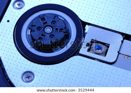 Close up of a notebook dvd drive and laser head in blue tone