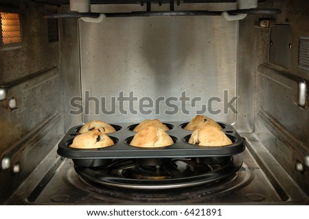 A tray of blueberry muffins in oven