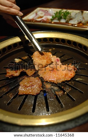 Korean barbecue - meat are being cooked on korean stove