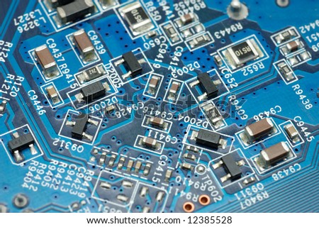 Close up of blue circuit board with microchips on a computer video card