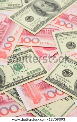 Closeup of US dollar bills and China yuan bills