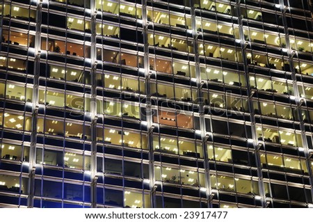 Background of office building windows at night