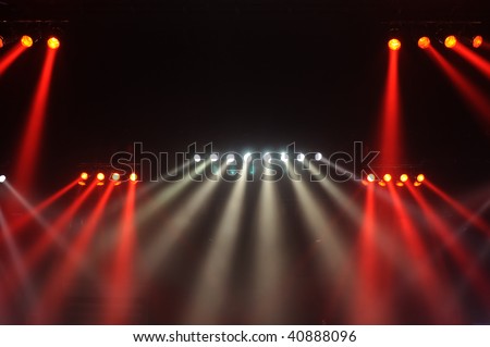 Red and white spot lights in a music concert