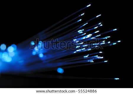Blue optical fibers against  the black background