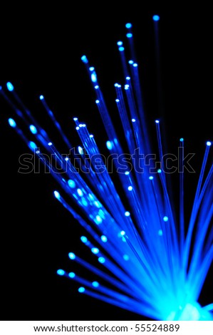 Blue optical fibers against  the black background