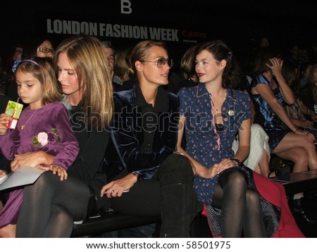 LONDON - SEPTEMBER 19: Jasmine Guinness attends London Fashion Week with a female friend on September 19, 2009 in London.