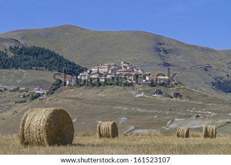 After the hay harvest on the Piano Grande in the mountains Sibellini