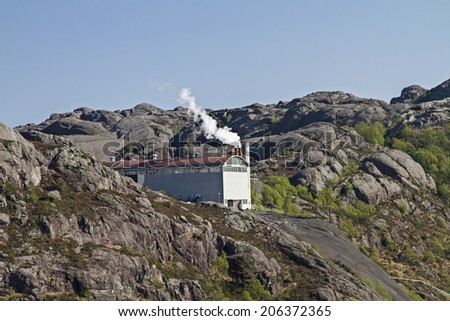 In beautiful and lonely mountain in Rogaland one sees this fuming industrial building