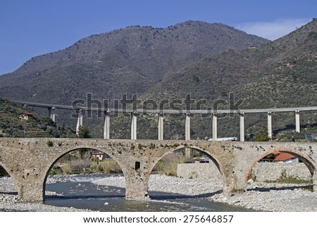 Taggia - medieval arched bridge and a modern highway bridge
