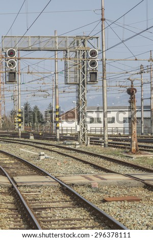 Rail - tracks, switches and signal masts on an Italian train station