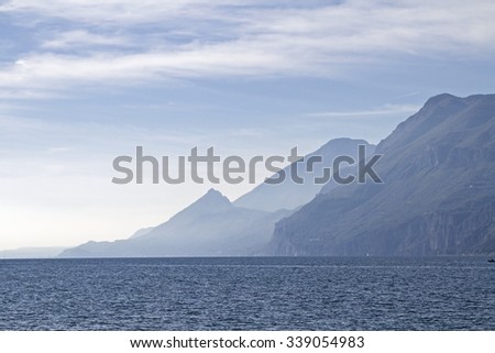 Lake Garda - lake and mountains in backlight