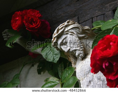 Religious symbol with red roses