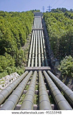 Many large pipes carry the water for power plant