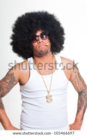 Hip hop urban black man retro afro hair wearing white shirt and golden jewelry isolated on white. Smoking cigarette. Looking confident. Cool guy. Studio shot.