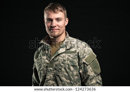 Military young man. Smiling. Studio portrait.