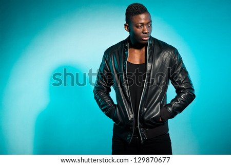 Cool urban stylish black american man. Fashion studio shot.
