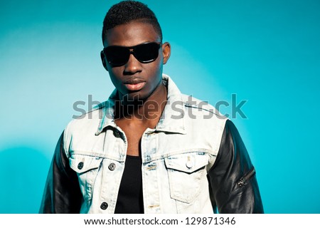 Cool urban stylish black american man. Fashion studio shot.