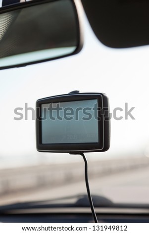 Car navigation system on front window in car.