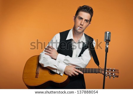country smoking cigarette singer guitar suit wearing retro studio shot shutterstock search