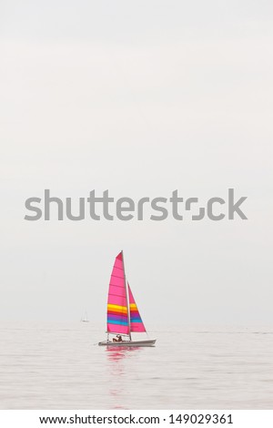 Sailing catamaran boat in the ocean. Recreation in summer.