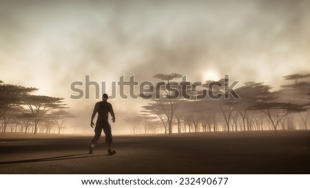 Male adventurer walking in misty savannah landscape at sunrise. Low perspective view.