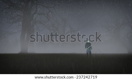 Serial killer with white mask holding bloody knife. Standing in misty winter forest at night. Low angle view.