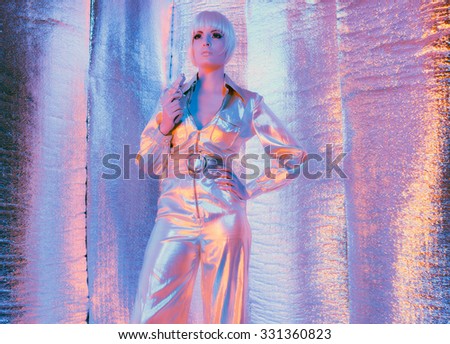 Space war woman holding gun wearing jump suit and sunglasses. Standing in reflective solar room.