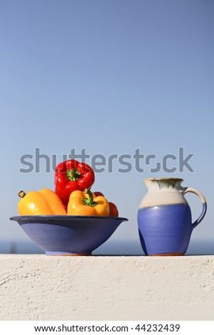 Greek still life with peppers and wine can