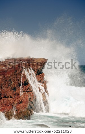 Big wave splashes against rock, The Cape of Good Hope, South Africa