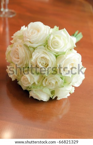 stock photo White wedding flowers on wooden table