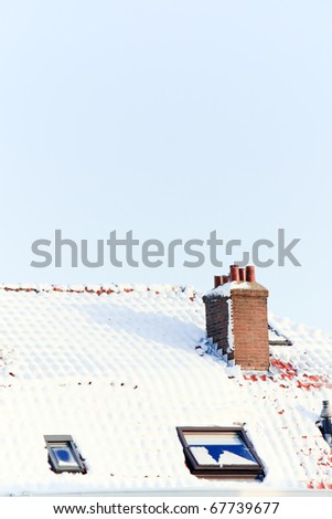 Roofs of houses covered with snow