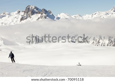 Winter landscape with skiing people. France. Alps. Saint Jean d'Arves.