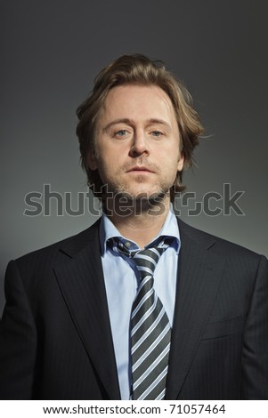Portrait of serious young business man. Studio photo. Thought. Thinking. In mind. Concentration.