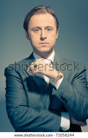 Vintage studio portrait of a serious young business man. Thinking. In thought. In mind. Concentration. Boss. Power. Old photo.
