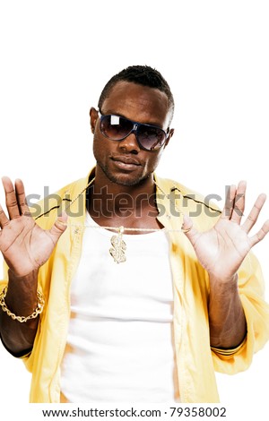 Studio portrait of cool black gangster rapper with yellow jacket and sunglasses. Isolated on white background.