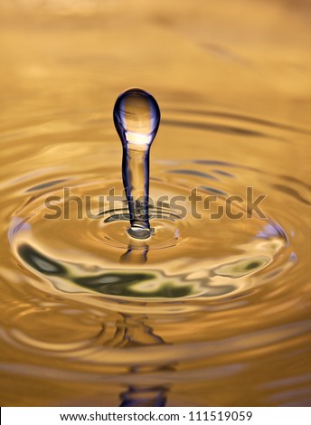 Yellow water funnel with concentric circles and reflection