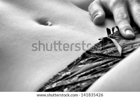 Closeup of woman abdomen and underwear flat tummy