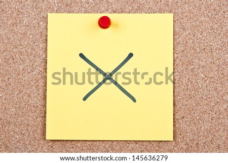 note on wood in yellow with wrong cross