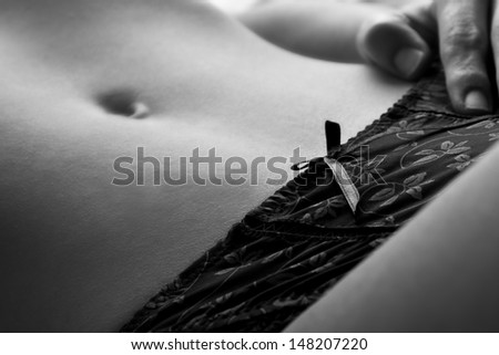 Closeup of woman abdomen and underwear flat tummy artistic conversion
