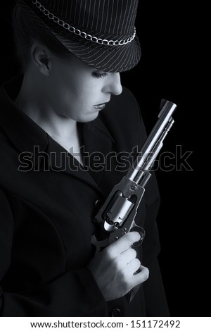 Dangerous woman in black with silver handgun and stylish hat artistic conversion