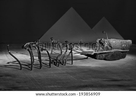 Iron nail slaves pull brick on rope concept abstract image artistic conversion