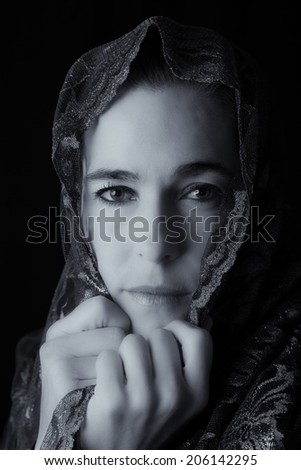 Middle Eastern woman portrait looking sad with a hijab artistic conversion