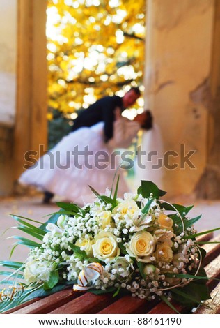 stock photo The beautiful wedding bouquet flowers lays on a bench 