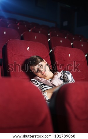 Sleeping woman at the cinema