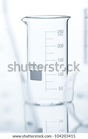 Chemical flask with a blue laboratory test tubes inside, isolated